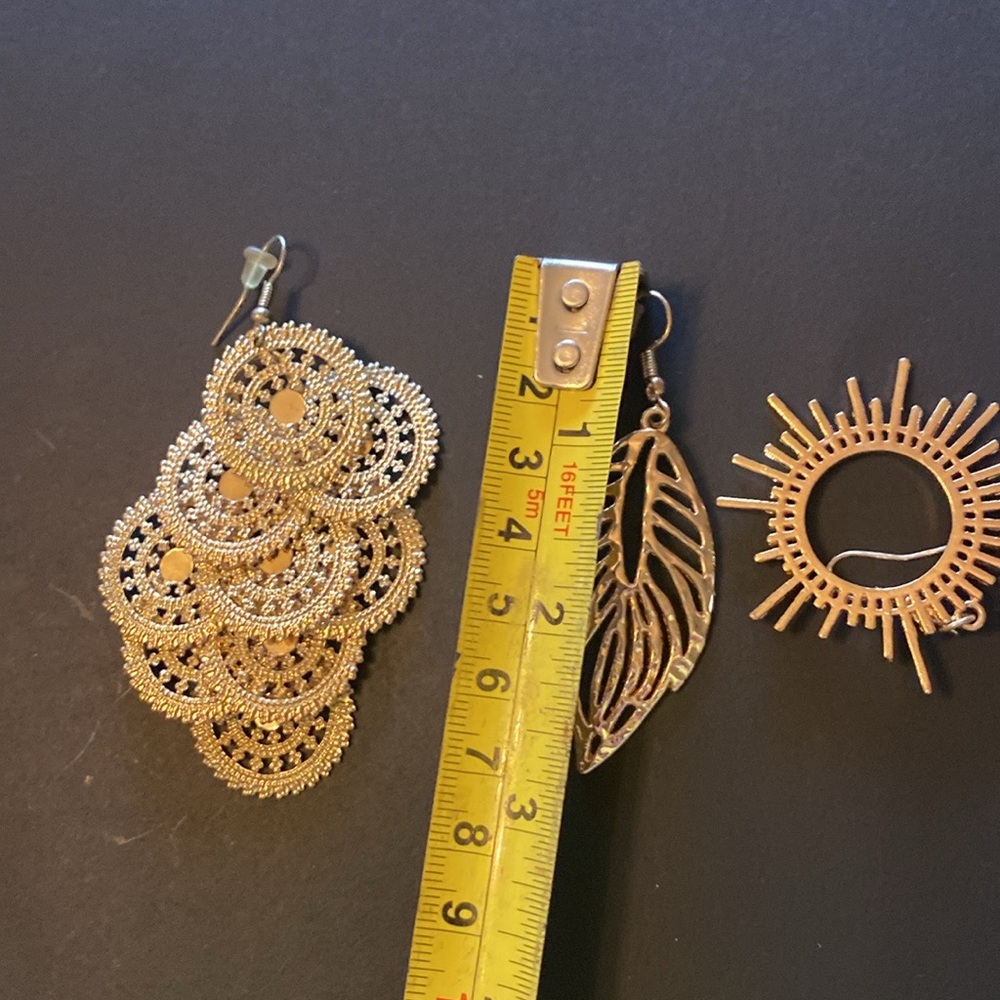 3 pair costume jewelry earrings in gold tone.